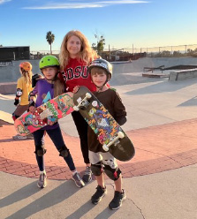 mother with kids at skate park