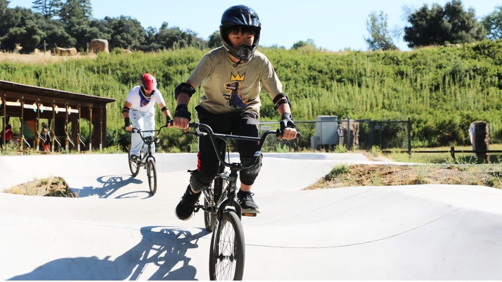 pump track at surf with kids riding