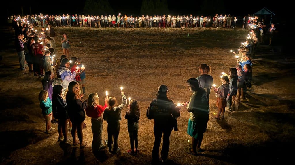 overnight camp boys in canoe on lake